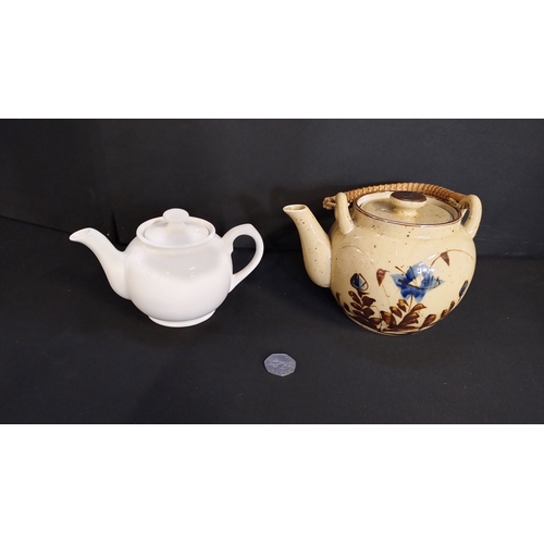 117 - Two vintage teapots, one white sadler, one vintage hand painted rattan handled