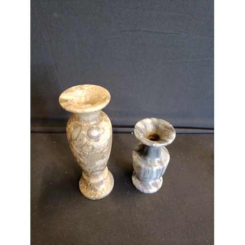 141 - 2 marble vases approximately 15cm and 10cm tall