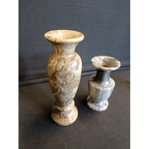 141 - 2 marble vases approximately 15cm and 10cm tall