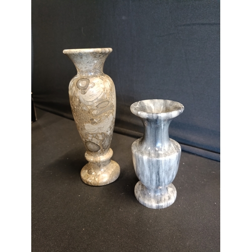 141 - 2 marble vases approximately 15cm and 10cm tall