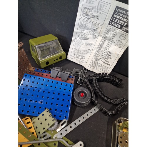 170 - A selection of vintage MECCANO. Includes, tools, screws, bolts, plates, flexi track, wheels, tyres a... 