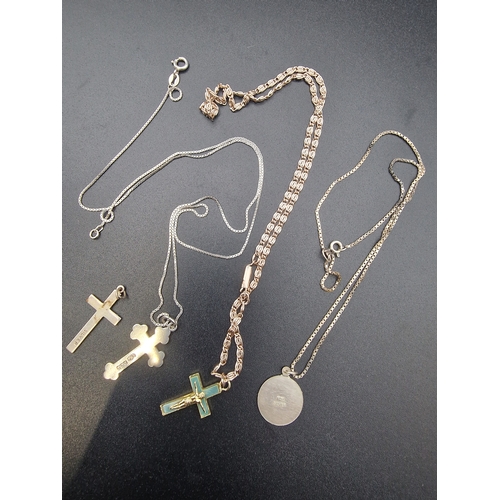 209 - Four pieces es of vintage religious jewellery. Three sterling silver crucifix and a St. Christopher.... 