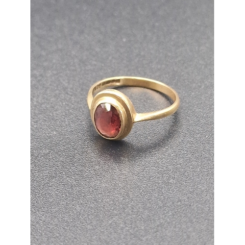 210 - 9ct gold ladies ring with red garnet.  Hallmarked 375.
Weight approximately 1.64g
Size M