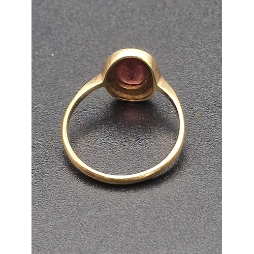 210 - 9ct gold ladies ring with red garnet.  Hallmarked 375.
Weight approximately 1.64g
Size M