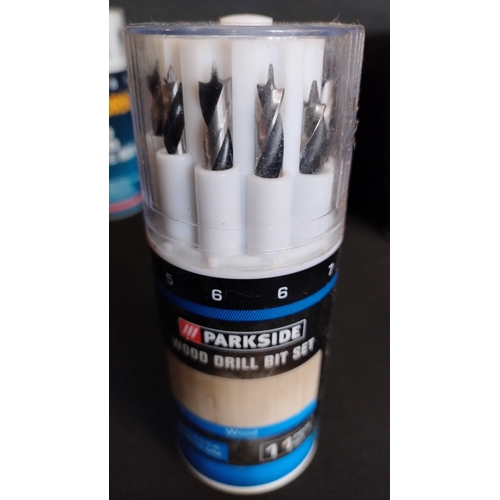 269 - 5  parkzone cans containing various drill bits. Wood, masonry, metal,