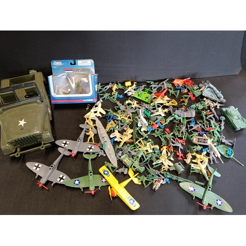 309 - Collection of military themed toys including a model Spitfire by Corgi