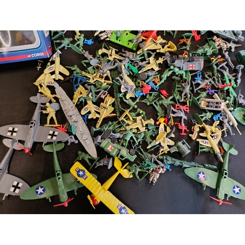 309 - Collection of military themed toys including a model Spitfire by Corgi