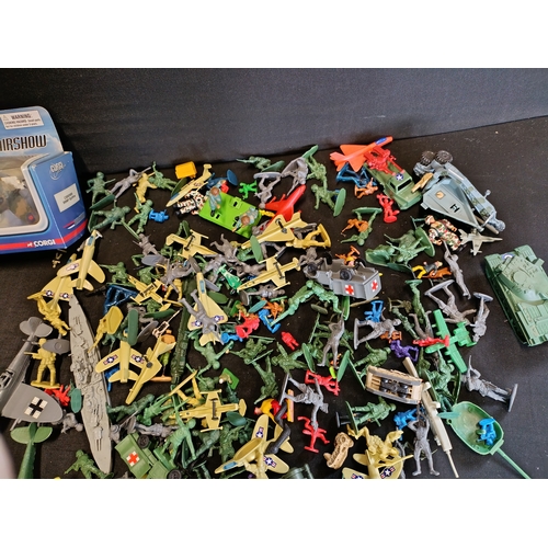 309 - Collection of military themed toys including a model Spitfire by Corgi