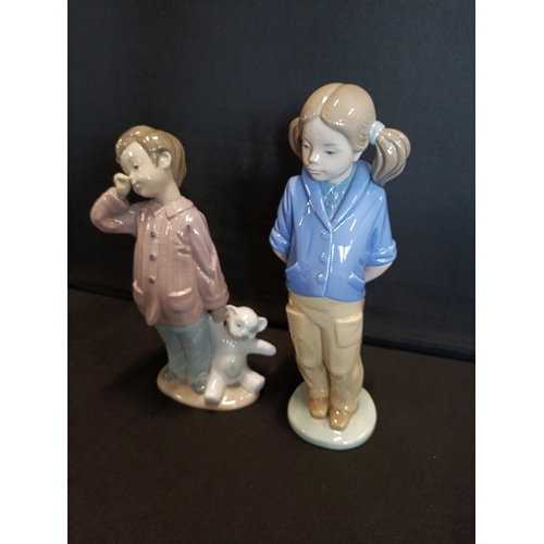 310 - 2 Nao by Lladro figurines, Girl with pigtails and satchel and Sleepy boy with teddy bear