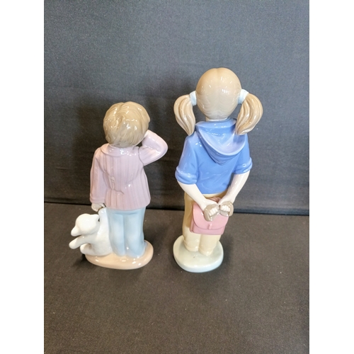 310 - 2 Nao by Lladro figurines, Girl with pigtails and satchel and Sleepy boy with teddy bear