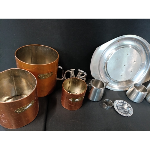 331 - Selection of mixed metal Branded  items including 4 copper canisters, a Swan brand milk jug and Suga... 