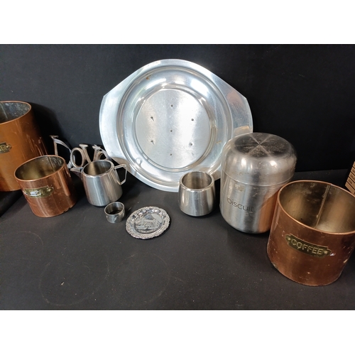 331 - Selection of mixed metal Branded  items including 4 copper canisters, a Swan brand milk jug and Suga... 