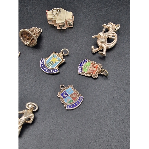 217 - A collection of various sterling silver charms.