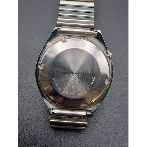 218 - A mens SEIKO watch with metal  stretch strap.