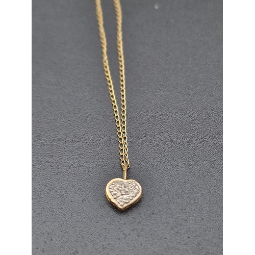 220 - A delicate ladies 9ct gold bracket with heart charm.