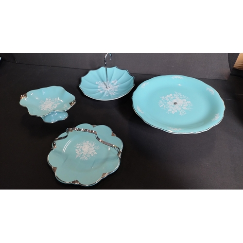 360 - Rare Royal Winton duck egg blue cake plates in various styles, umbrella's, cake stand and others