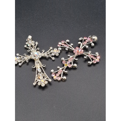 226 - Two large diamanté crucifix