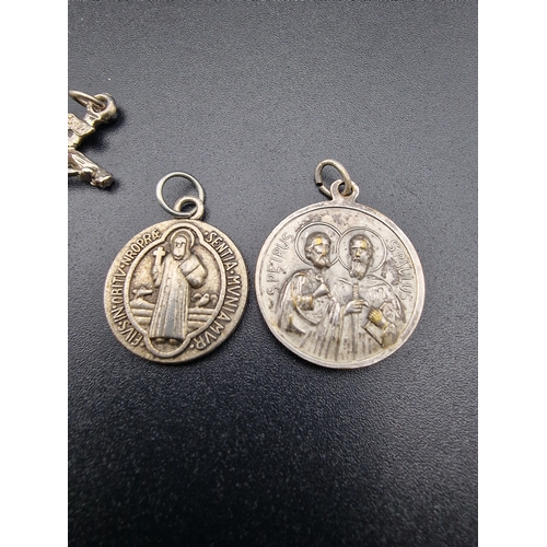 234 - A selection of sterling silver and silver religious items.  With two sterling silver chains.