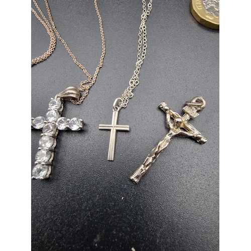 234 - A selection of sterling silver and silver religious items.  With two sterling silver chains.