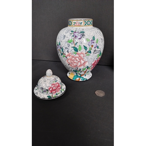 402 - One floral design ginger jar with lid, Sheraton and sons measures 10.5 inches and one  satsuma vase ... 