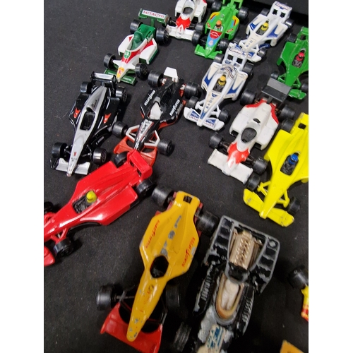 417 - Approximately 26 formula one diecast cars.  Matchbox, mojoeite, corgi juniors and Corgi.