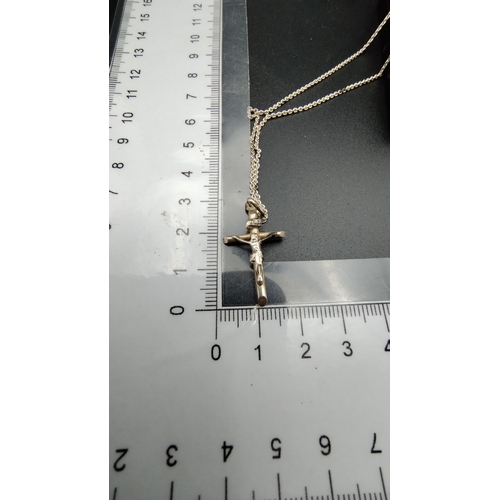 519 - Sterling silver crucifix on silver chain, chain length approximately 25 in,  approximate weight 4.77... 