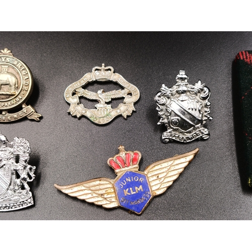 92 - Selection of military and police items including a Royal Scots badge, police badges and more