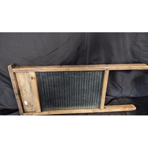 112 - Vintage glass washboard measures approx 28.5 x 13.5