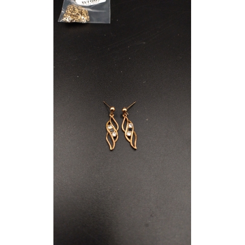 24 - 9ct gold drop earrings set with sapphire and cubic zirconia stones