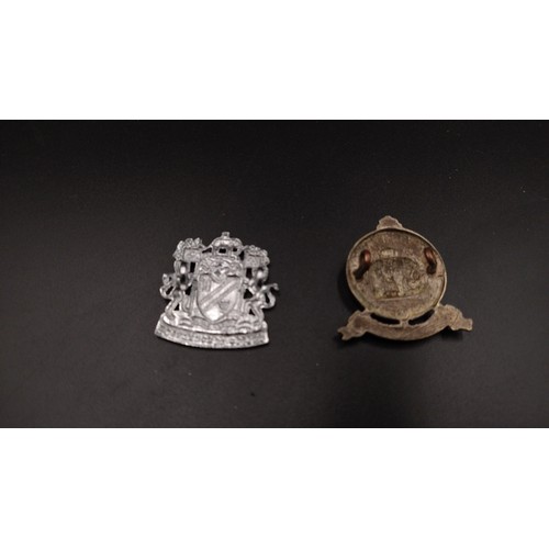 92 - Selection of military and police items including a Royal Scots badge, police badges and more