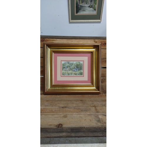 34 - Pair of gilt framed watercolour paintings of a horse drawn carriage, and horse riders. Measures appr... 