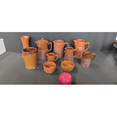 42 - Collection of vintage brown textured Lovatte Langley ware pottery including jugs, bowls, and other i... 