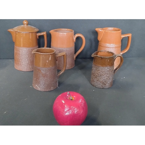 42 - Collection of vintage brown textured Lovatte Langley ware pottery including jugs, bowls, and other i... 