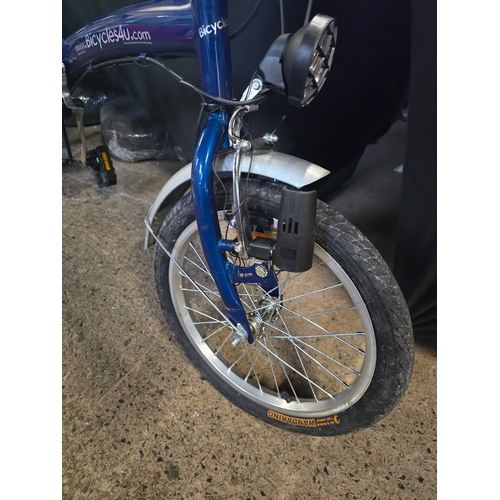 101 - Like new blue folding bike with storage bag and accessories