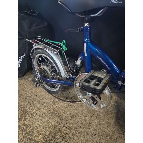 101 - Like new blue folding bike with storage bag and accessories