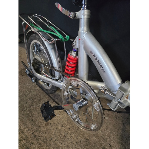 102 - Like new folding bike with storage bag and accessories