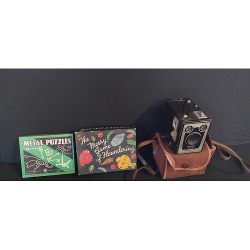 112 - Various vintage items including a brownie camera, 2 games, 3 queens chins  cups and saucers, clothes... 