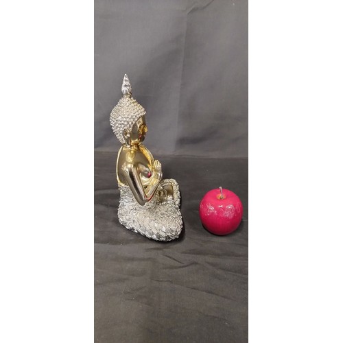 21 - Gold and silver mirrored Buddha. Measures approx H 24.5 X W 18 x D 12 cm