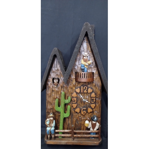 27 - A unique battery operated cuckoo clock with cowboys and an owl. Measures approx H 65.5 x W 35.5 x D ... 