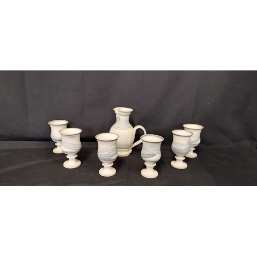 29 - Ingleton pottery  6 goblet wine set, i. Light glaze with serving jug