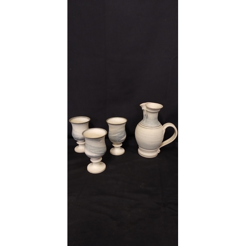 29 - Ingleton pottery  6 goblet wine set, i. Light glaze with serving jug