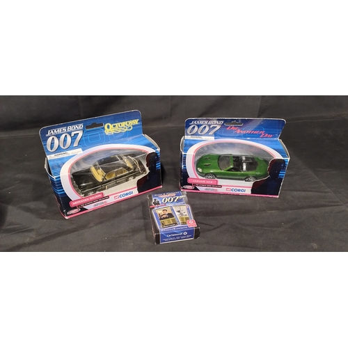 47 - Two Corgi James Bond diecast vehicles Octopussy, Die Another Day and a Deck of James Bond cards, Bla... 