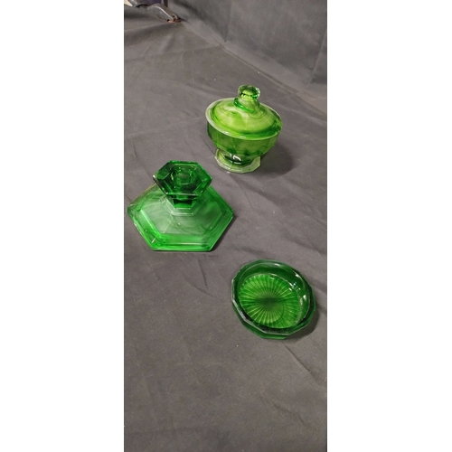 52 - Vintage emerald green art glass dressing table set comprising of candle holders, trinket dish and ot... 