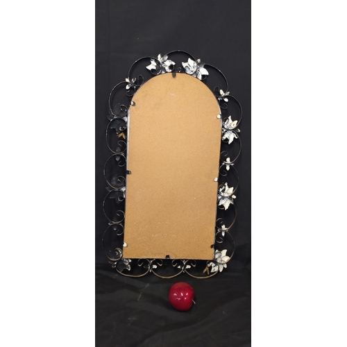 88 - Vintage metal framed mirror with flower decoration. Measures approx H 74.5 x W 44.5 cm