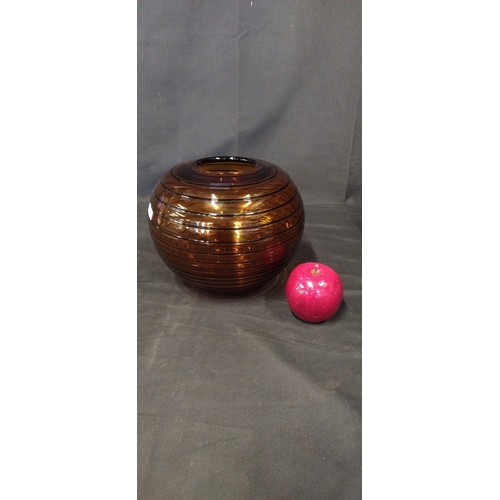 101 - Amber and black coloured round glass vase