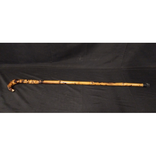 112 - Three various sized walking sticks, made from bone and brass with Egyptian carving, horn with a badg... 