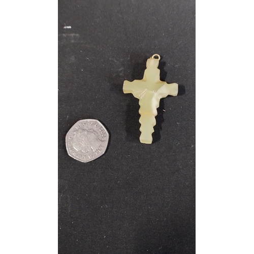 154 - Onyx crucifix measures approx H 6 x W 3.5 cm