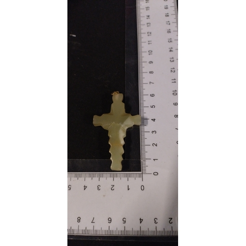 154 - Onyx crucifix measures approx H 6 x W 3.5 cm