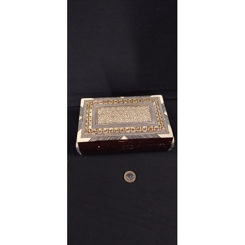 184 - Wooden marketory inlaid box  with mother of pearl and bone and red velvet lining. Measures approx H ... 