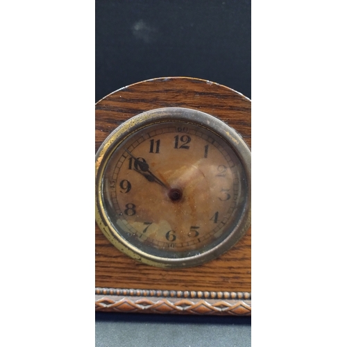 203 - Wind up mantle clock retailed by Bravingtons Ltd of London. Measures approx 16 x 29.5 x 7.5 cm